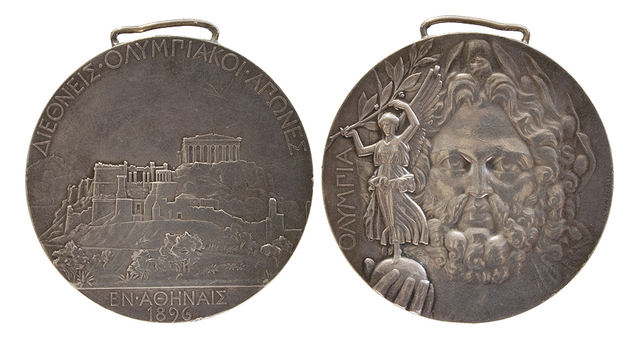 Medaille in Silber. Auf der Vorderseite die Athener Akropolis mit Parthenon und Propyläen und auf der Rückseite der Kopf von Zeus