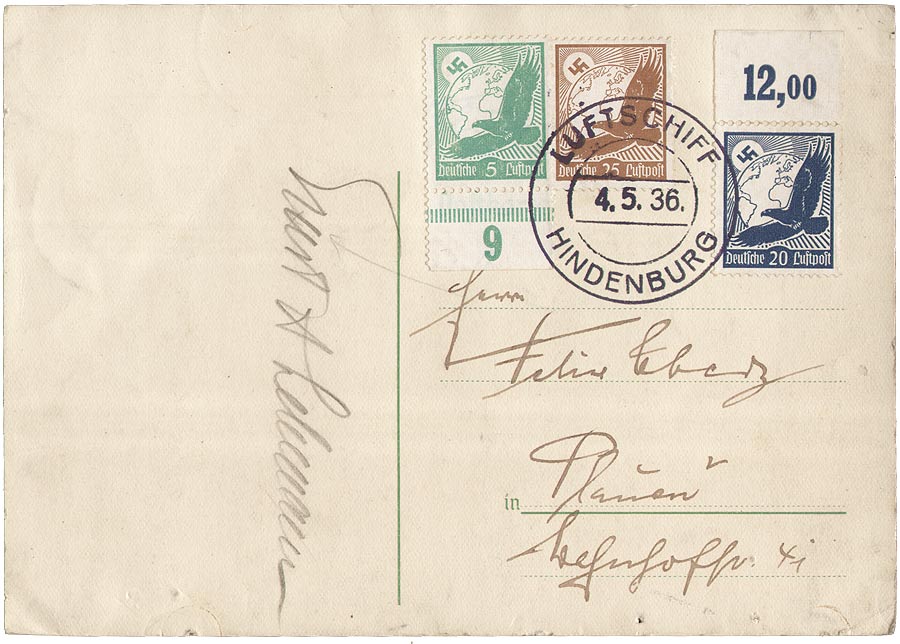 Postkarte mit Poststempel und Briefmarken