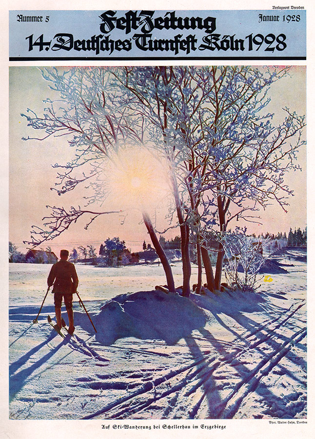Festzeitung mit Abbildung eines Skiläufers in winterlicher Landschaft