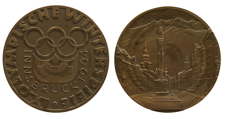 Medaille mit  Logo der Spiele und der Inschrift 