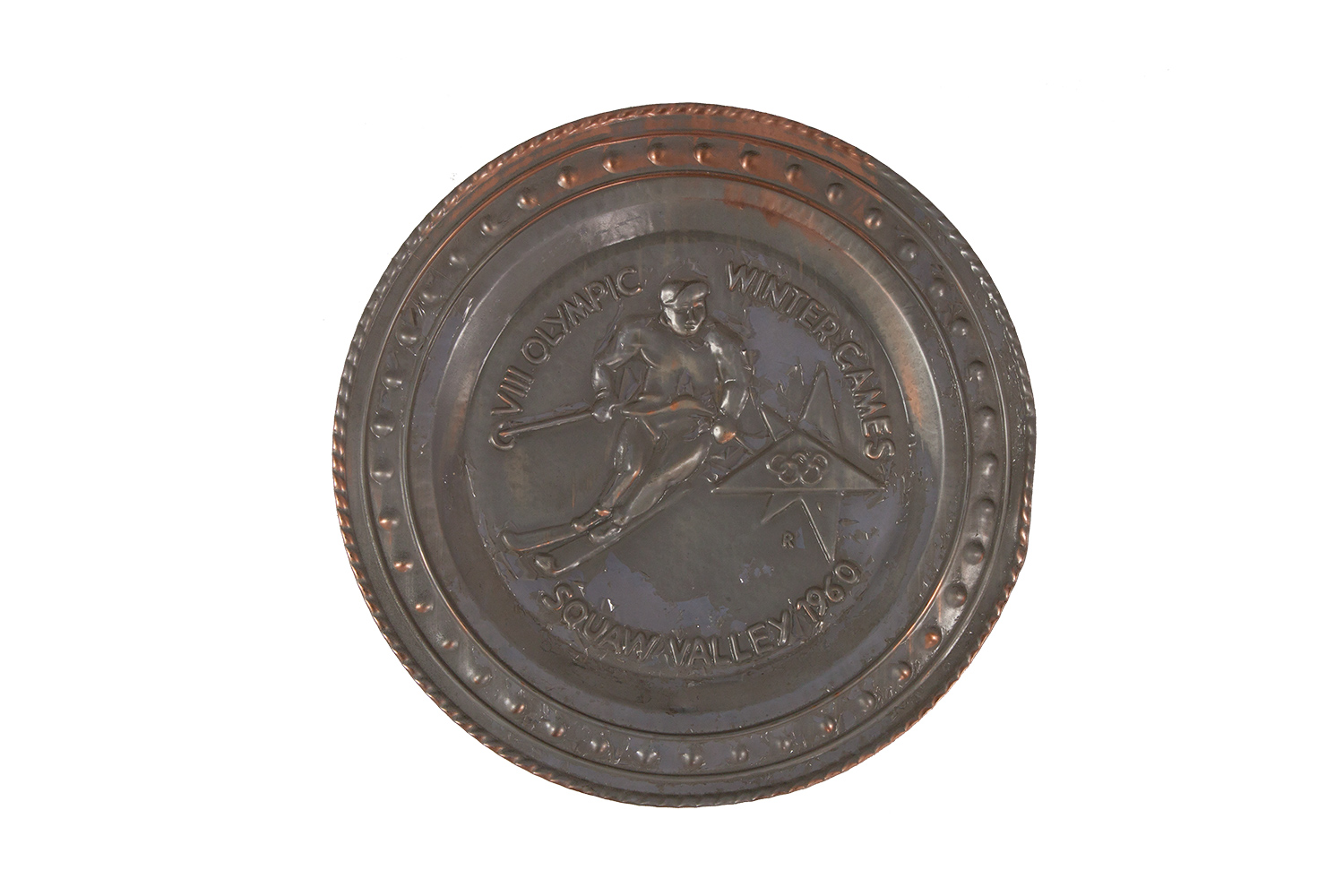 Zierteller mit Abbildung eines Skifahrers und einer Inschrift