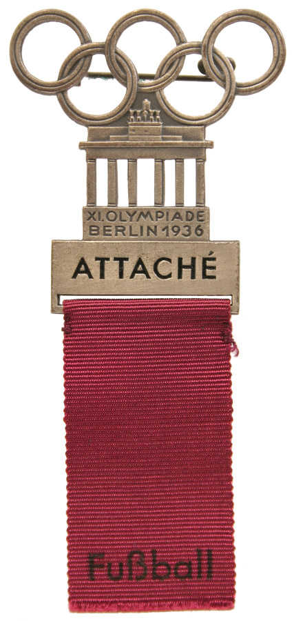 Goldenes Teilnehmerabzeichen in Form des Brandenburger Tors mit Olympischen Ringen darüber